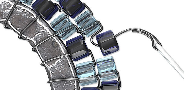 Seed beads being looped onto a ring